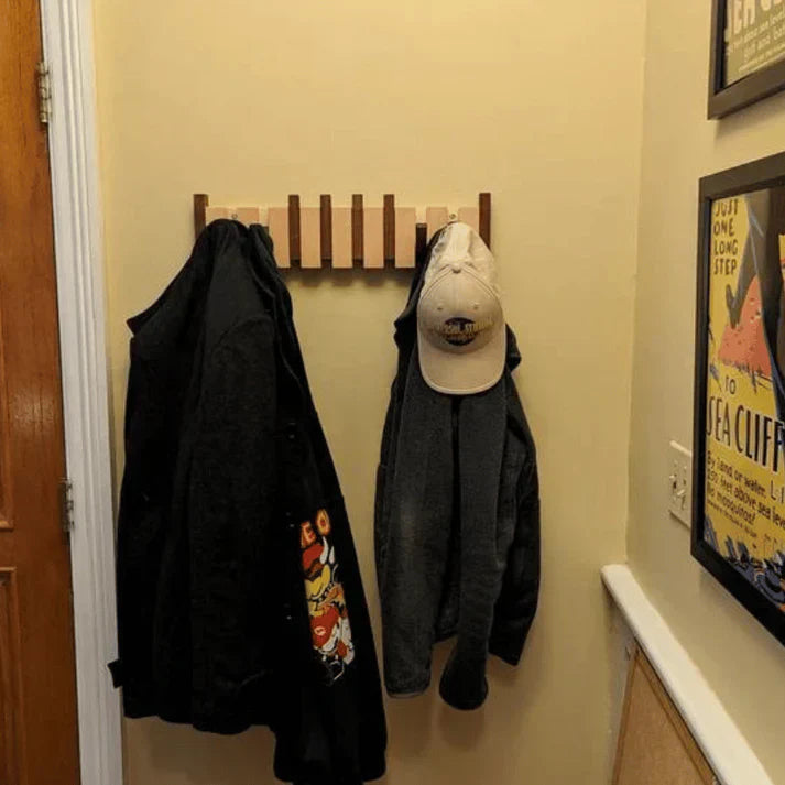 Elegant piano key wall mounted coat rack for entryways, modern home decor storage.