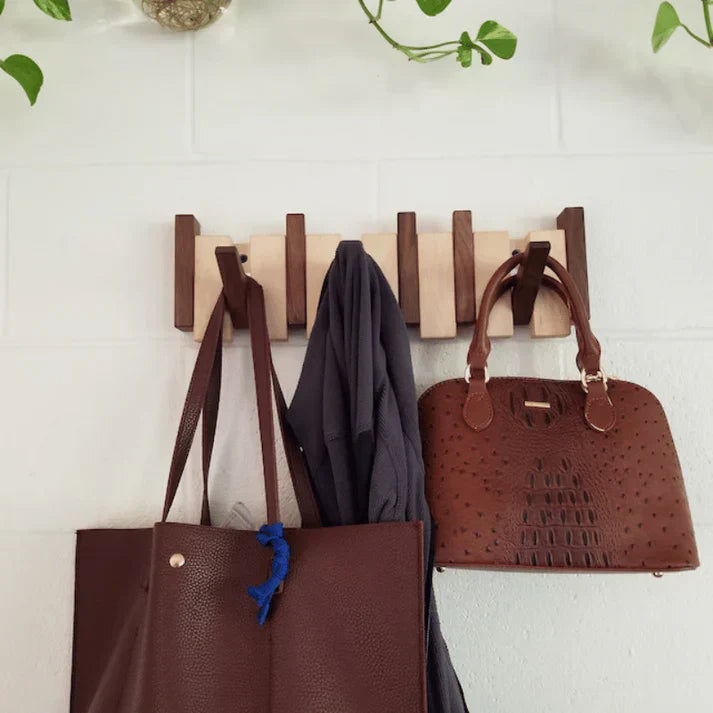 Modern piano key coat rack, wall mounted entryway organizer with multiple hooks.