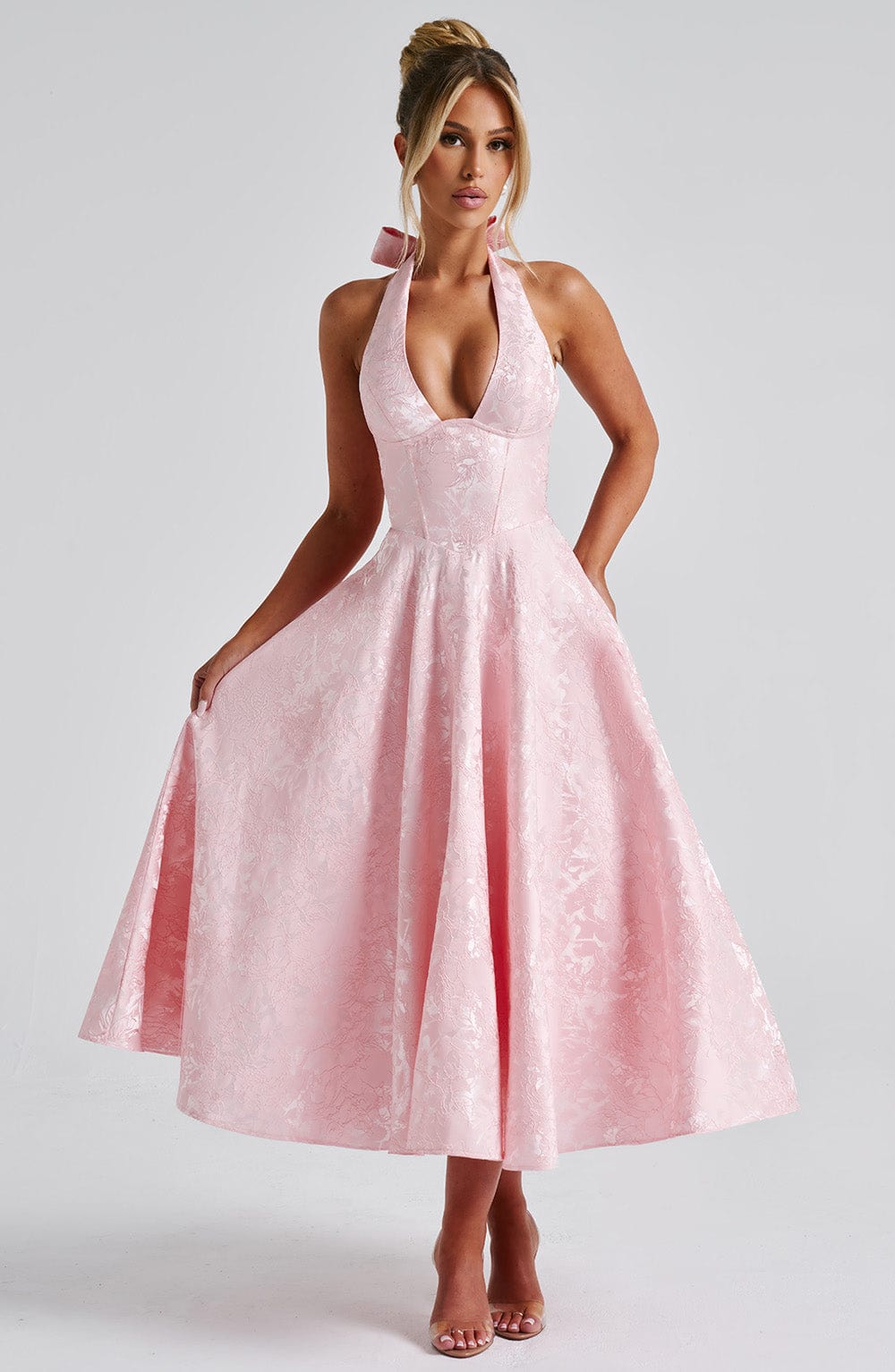 Elegant pink halter neck midi dress for women, perfect for a wedding guest or cocktail event.