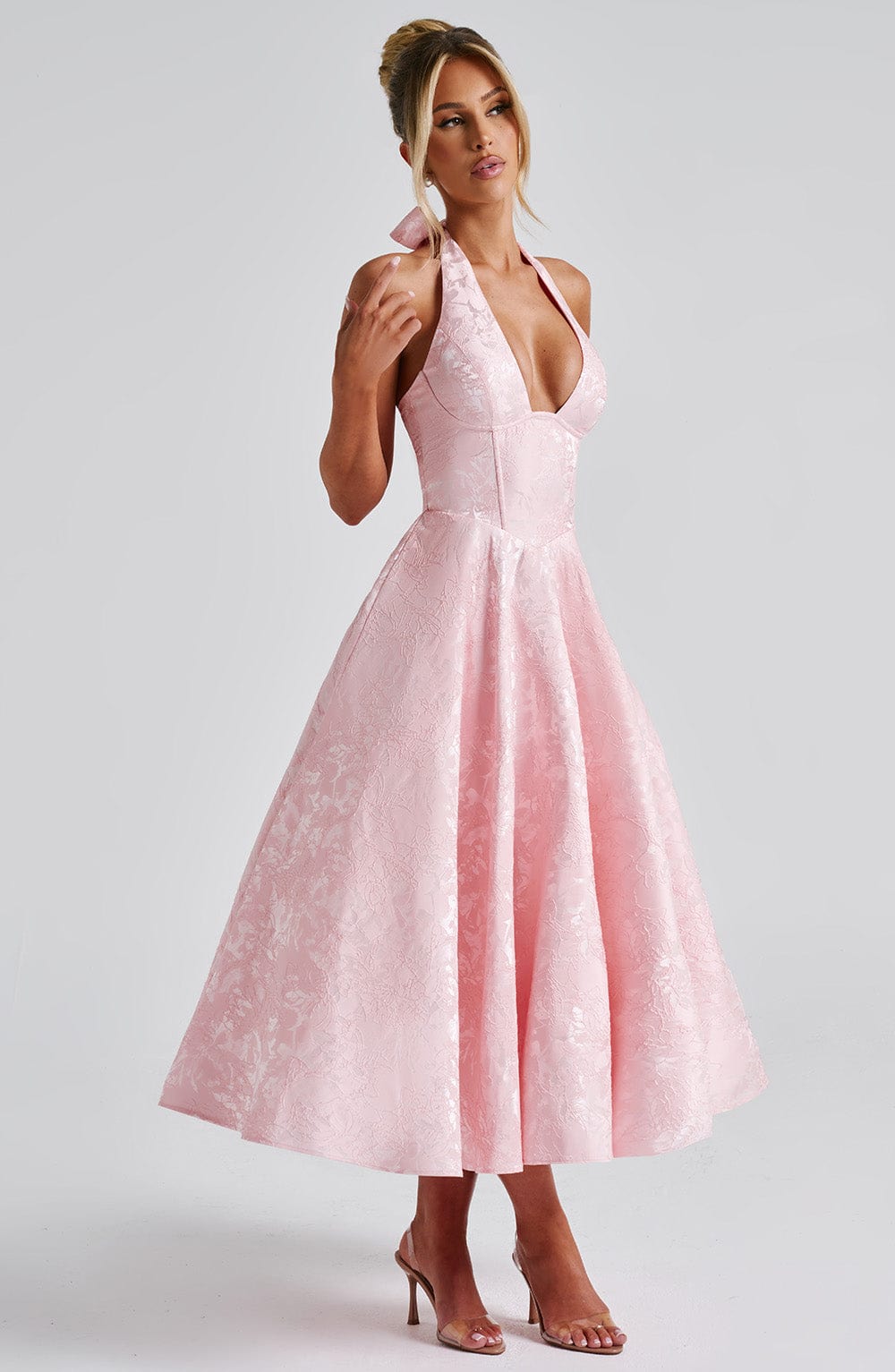 White formal midi dress with a stylish halter neck, an elegant choice for women.