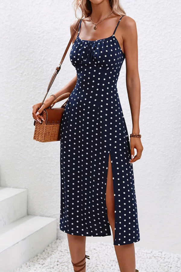 Chic polka dot pleated halter midi dress for women. Elegant sleeveless style, ideal for summer parties.