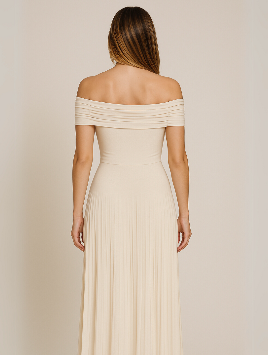Maxi pleated sleeveless dress in a luxurious fabric, suitable for formal evening wear.