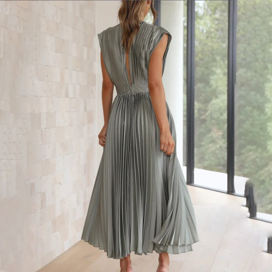 Women's fashionable V-neck midi dress with elegant pleats, ideal for a wedding or cocktail event.