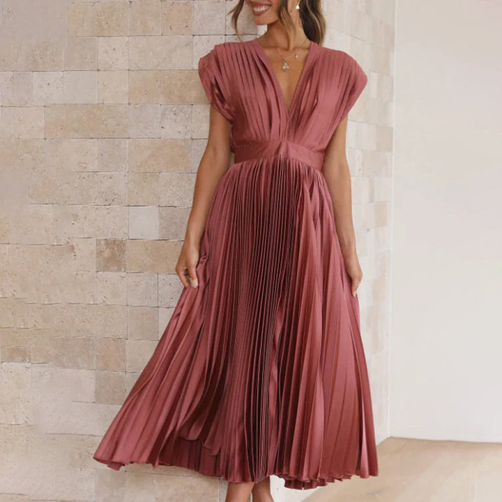 Chic women's V-neck midi dress with elegant pleats, perfect for a wedding guest or party.