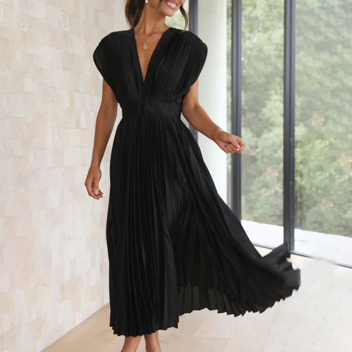 Stylish women's pleated midi dress with a flattering V-neck, suitable for spring or summer weddings.