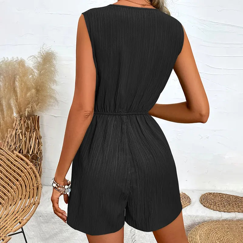 Women's stylish sleeveless romper with elegant pleats and a flattering wrap design