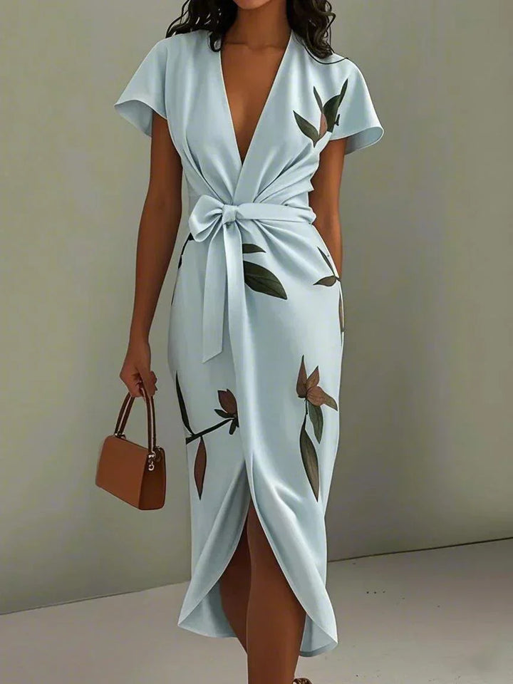 Chic women's printed wrap midi dress, perfect for summer casual or elegant occasions. Short sleeves.