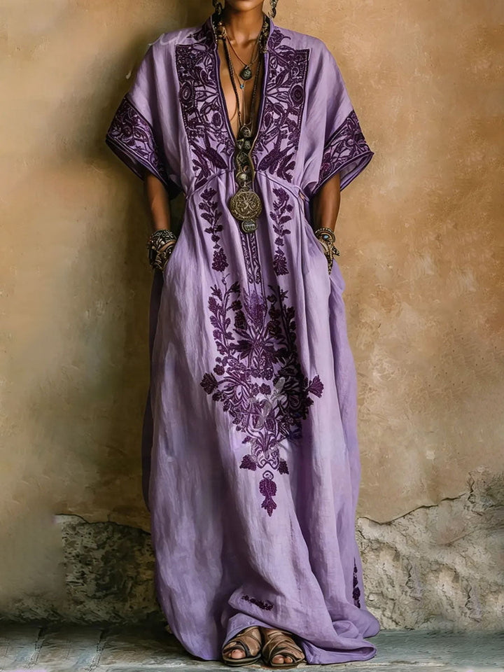 Elegant purple embroidered kaftan maxi dress with batwing sleeves, perfect for summer evenings or vacation.
