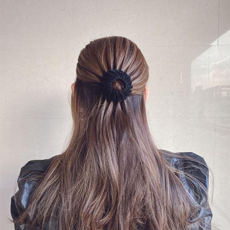 Close-up of a resin hairpin designed for instant elegant bun creation, a practical hair tool