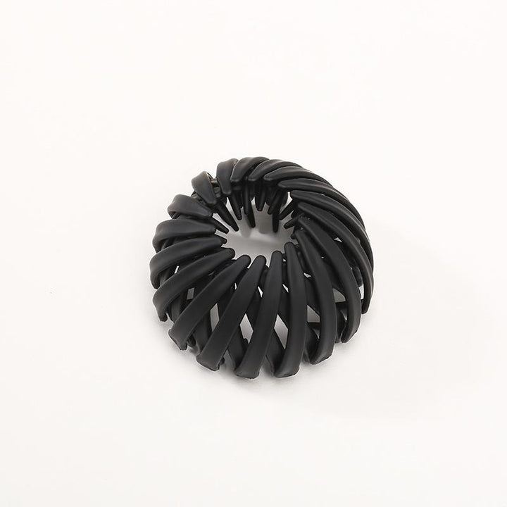 Detailed view of the women's instant elegant bun hairpin, highlighting its smooth resin finish
