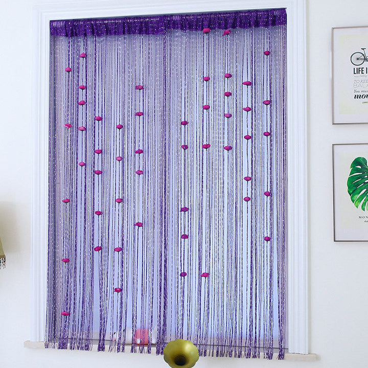 Rose pattern thread curtain with cascading tassels, creating a luxurious vibe