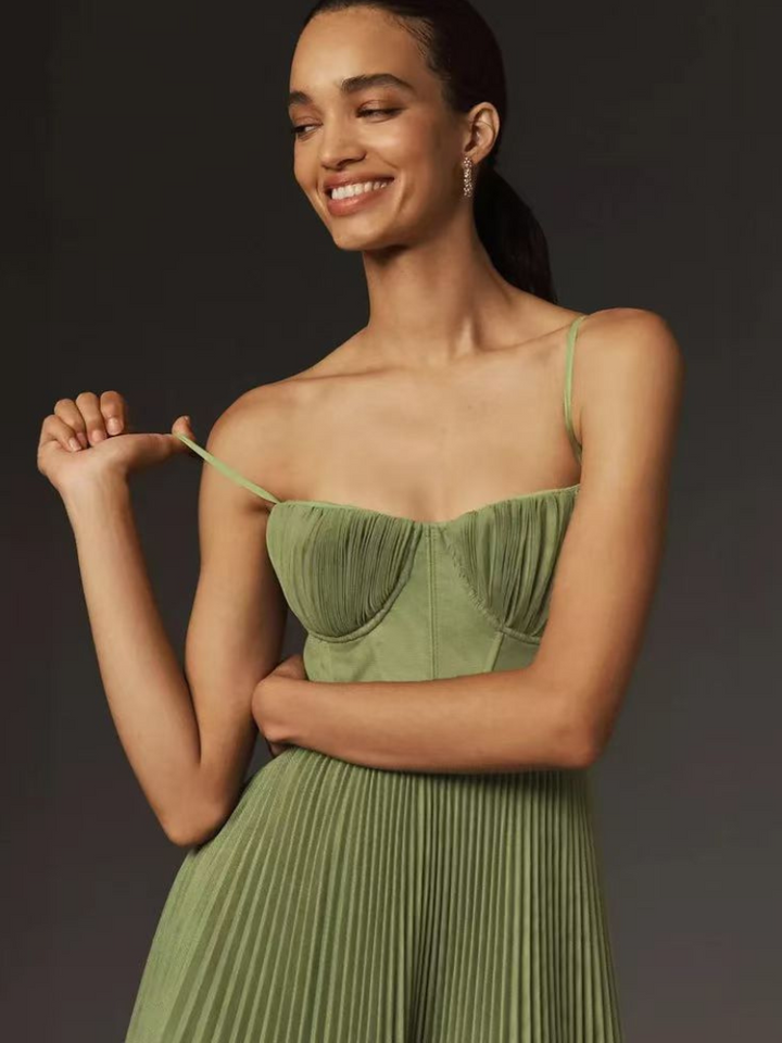Elegant sage green corset pleated maxi dress, a beautiful option for a wedding guest.
