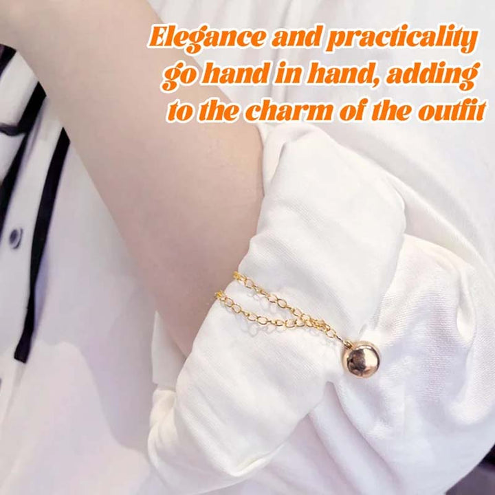 Magnetic clothing clip holding together the back of a blouse, creating a more fitted and polished look.