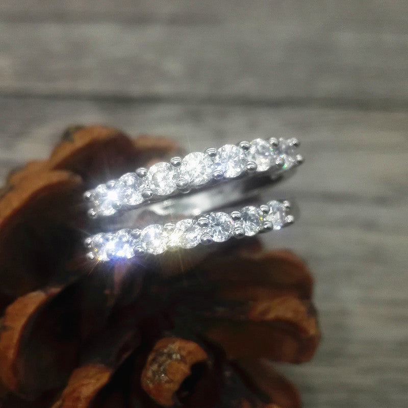 Top view of a silver ring with seven perfectly set zircon diamonds, a beautiful piece of jewelry.