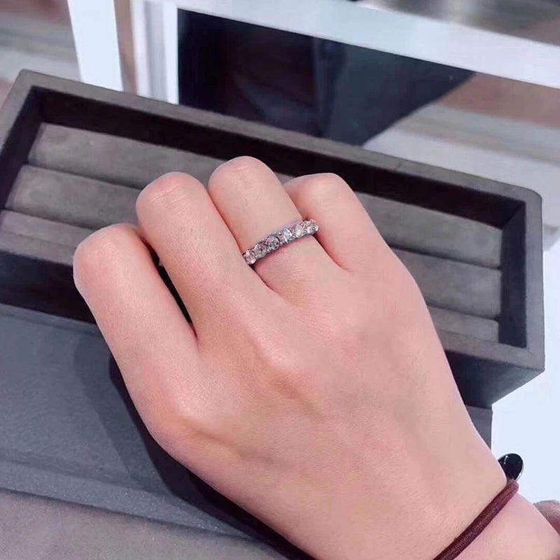 Detail of the seven zircon diamonds on a women's silver ring, emphasizing clarity and cut.