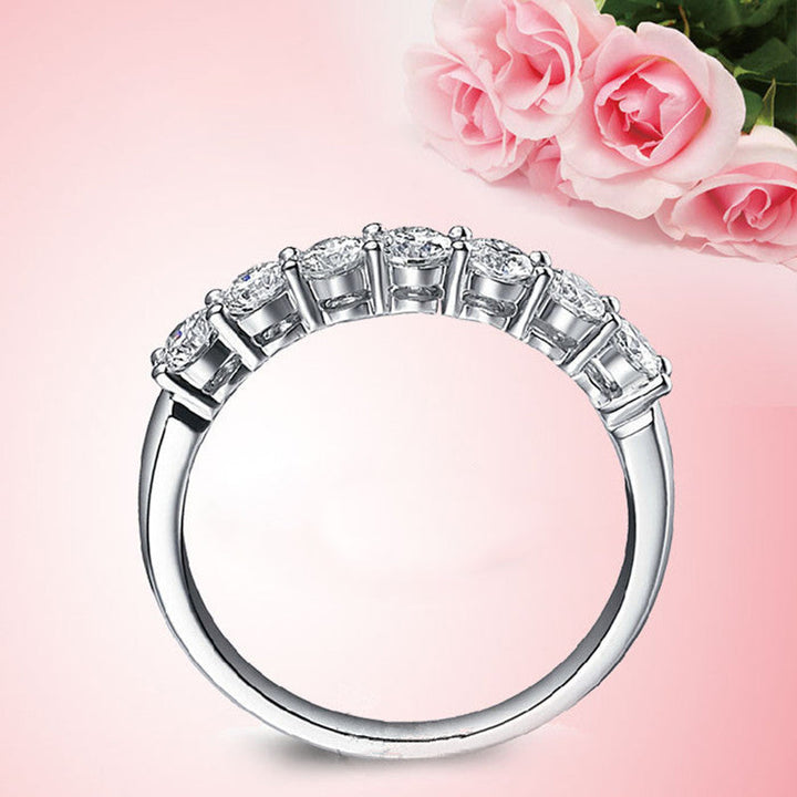 Side profile of an elegant seven diamond zircon ring, showing the setting craftsmanship.