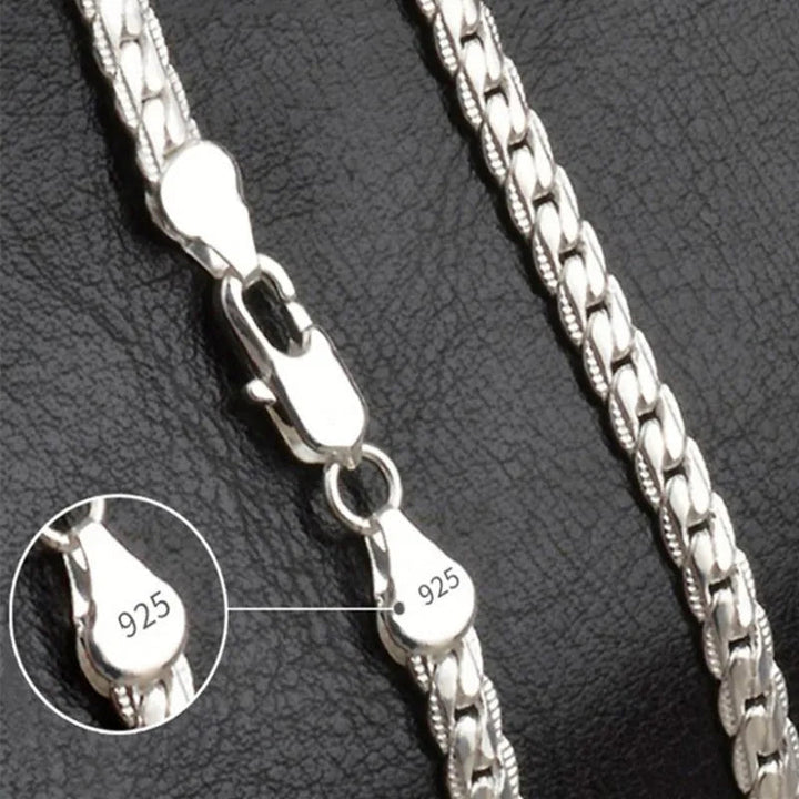 Elegant silver-tone lucky charm pendant necklace for women. Dainty fashion accessory, perfect for everyday or special occasions.