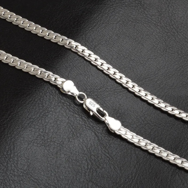 Dainty silver lucky charm necklace, an elegant fashion accessory for women. Ideal for everyday wear or a special occasion.
