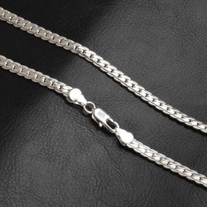 Dainty silver lucky charm necklace, an elegant fashion accessory for women. Ideal for everyday wear or a special occasion.