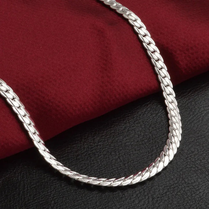 Elegant women's silver lucky charm necklace. A stylish pendant, perfect dainty jewelry and fashion accessory.