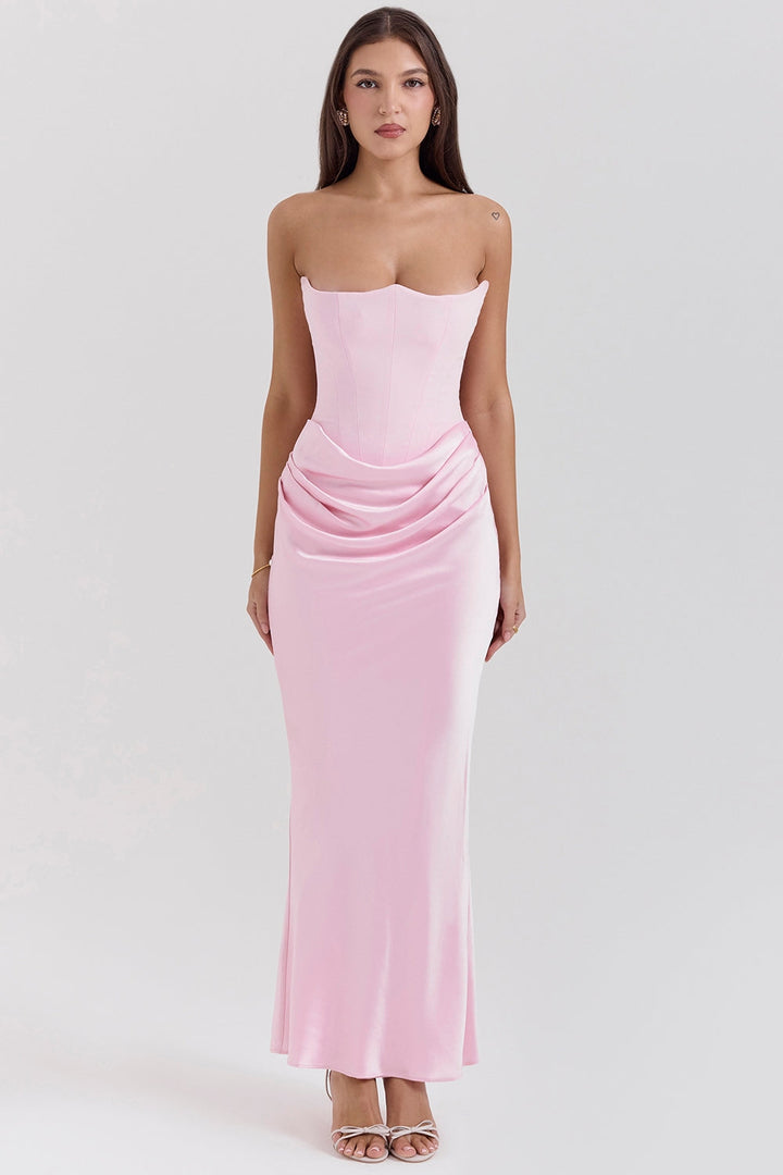 Model wearing a strapless maxi dress, showing its elegant fit for a wedding guest occasion.