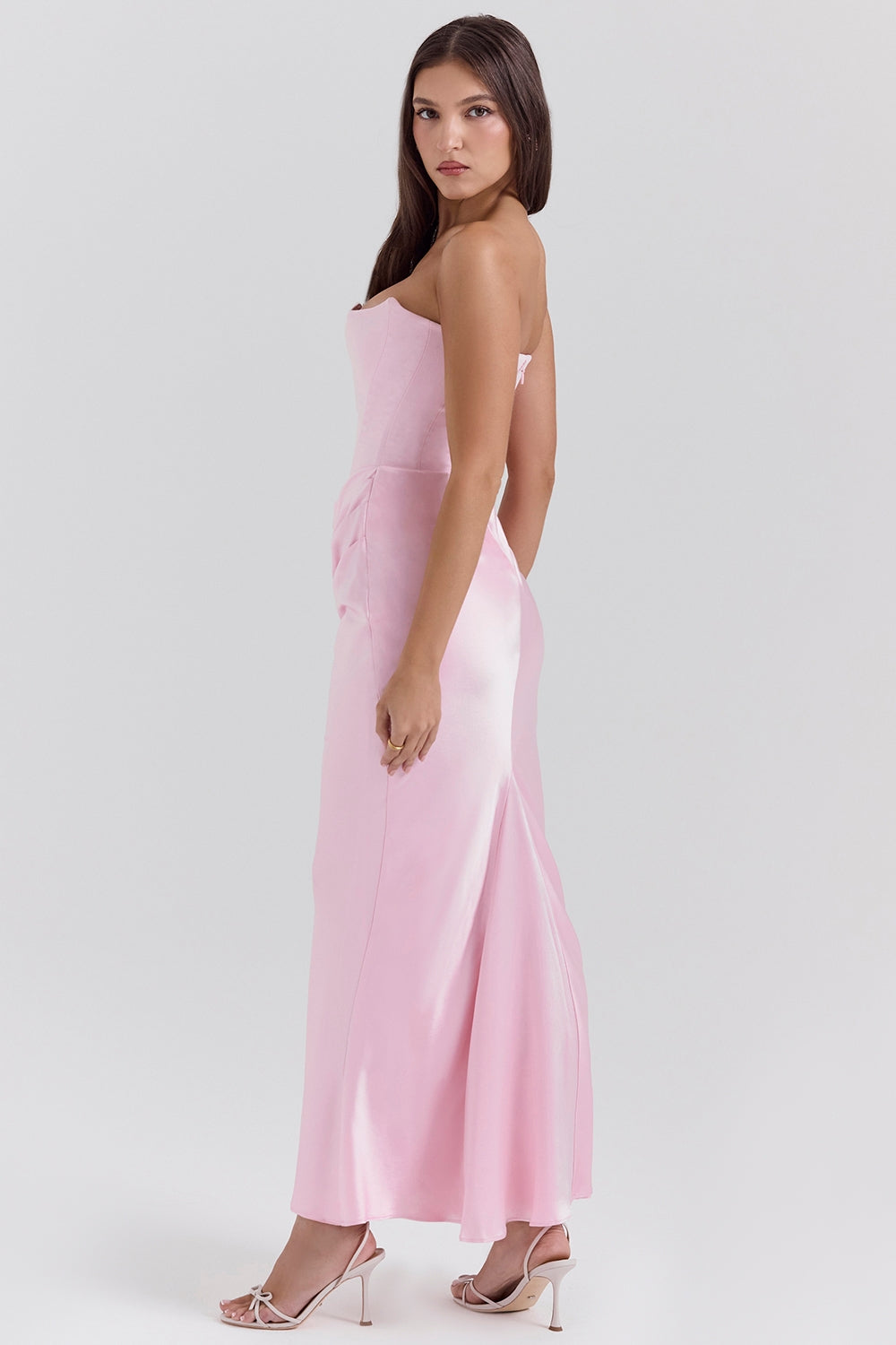 Close-up of the fabric texture of a strapless maxi dress, highlighting its quality for formal events.
