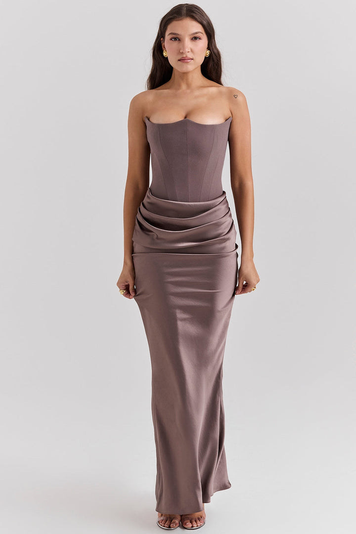Back view of a women's strapless maxi dress, showcasing its elegant flowing design for weddings.
