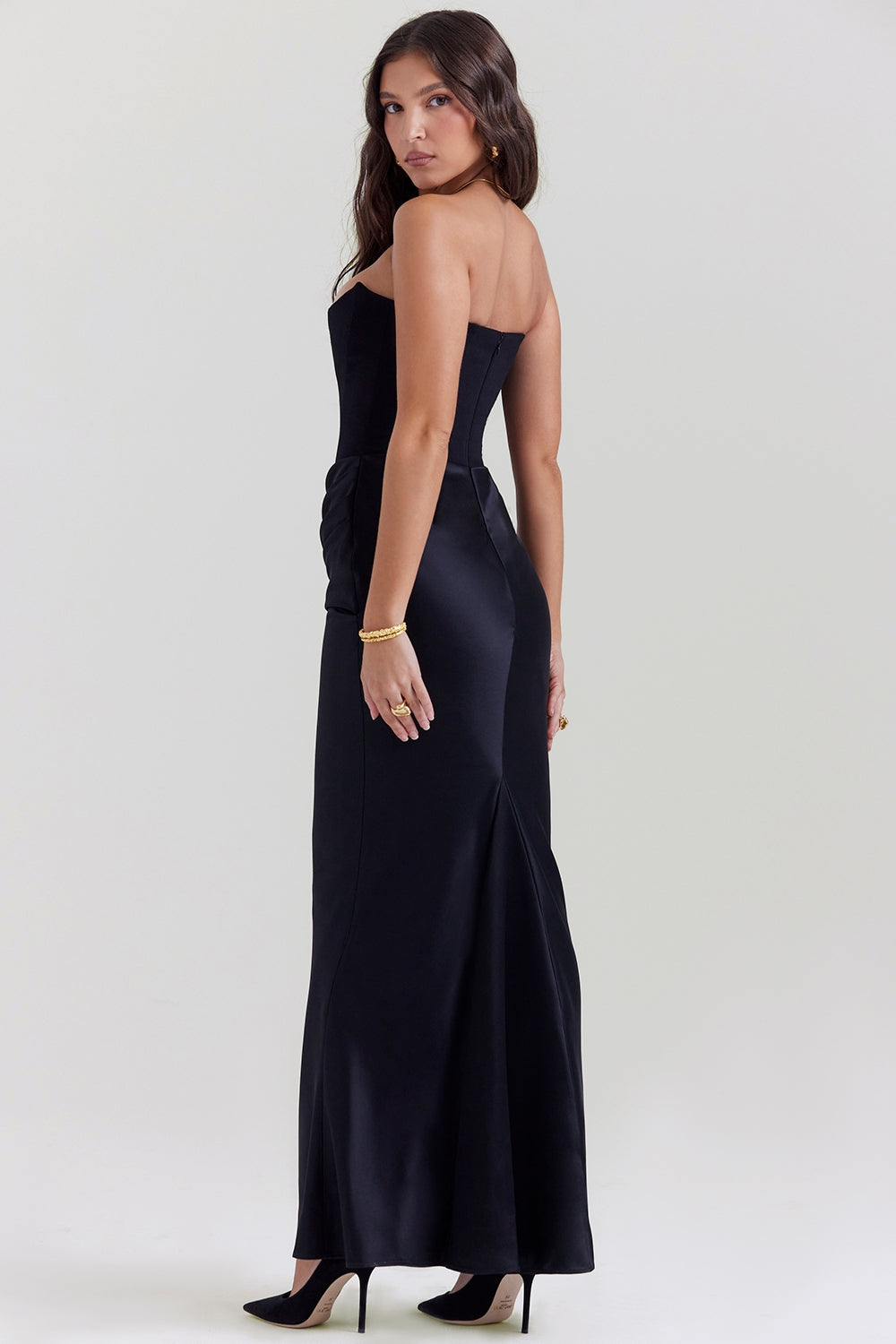 Flowing strapless maxi dress in a vibrant sapphire blue, ideal for a wedding guest ensemble.