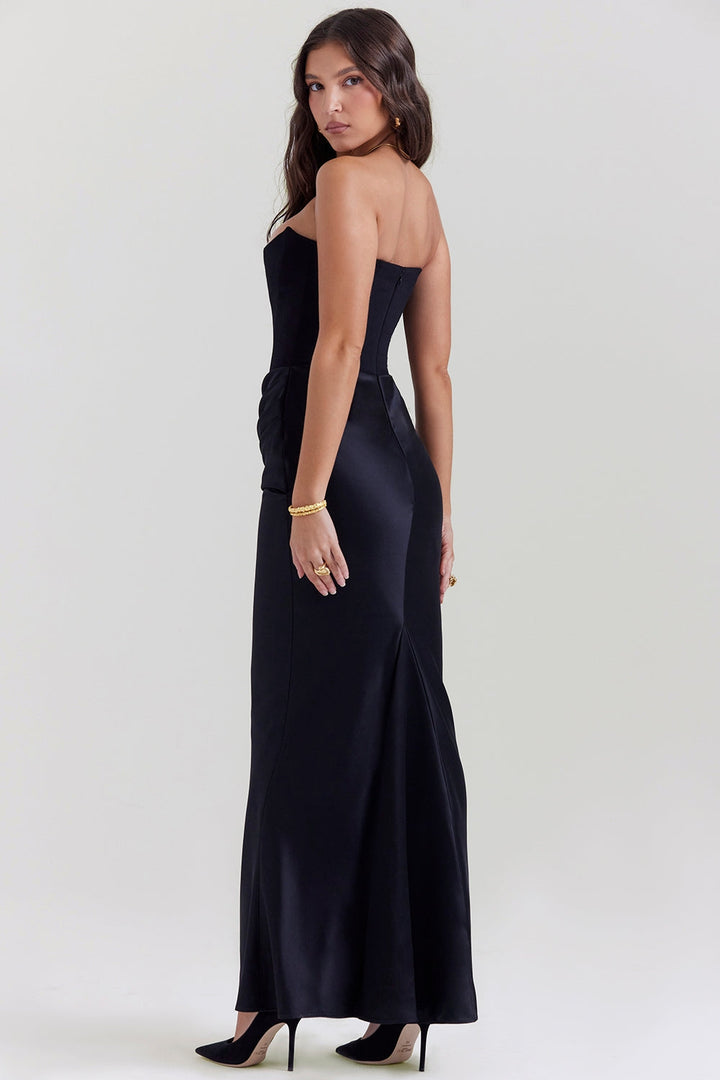 Flowing strapless maxi dress in a vibrant sapphire blue, ideal for a wedding guest ensemble.