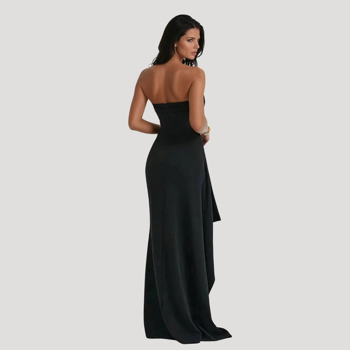 Chic black strapless maxi dress with a flattering silhouette, suitable for a formal occasion.