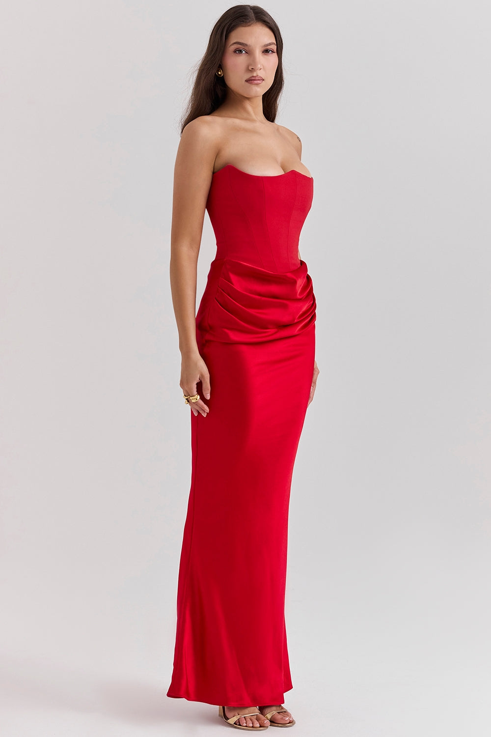 Strapless maxi dress with a flattering silhouette in a deep burgundy, perfect for formal events.