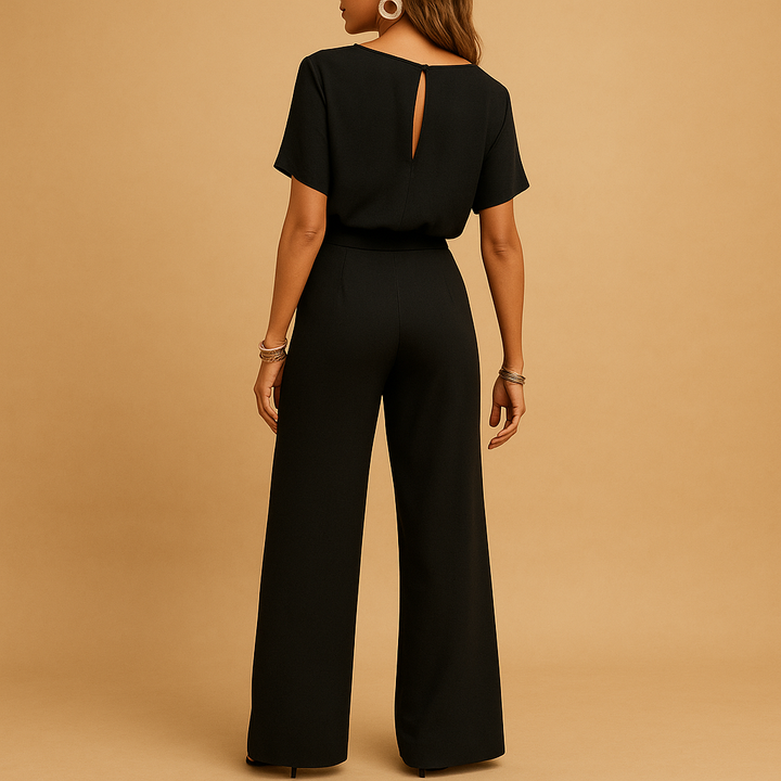 Sophisticated women's jumpsuit featuring a tailored cut and elegant flowy sleeves for parties.