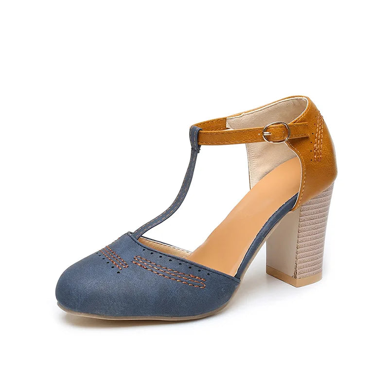 Underside of women's elegant two-tone block heel shoes, showing sole detail for comfort