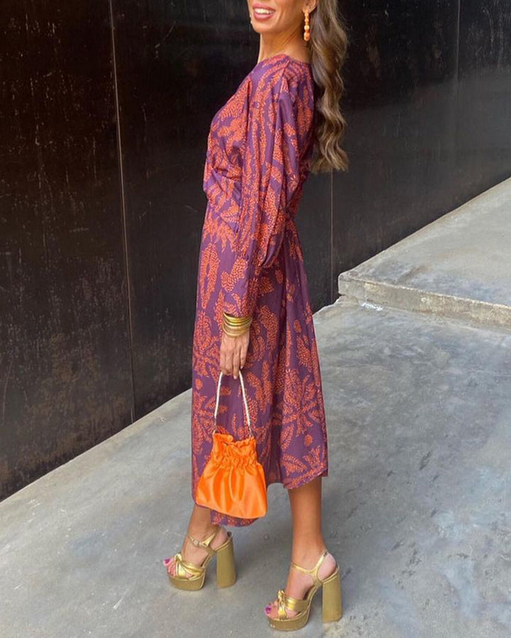 Elegant women's V-neck long sleeve midi dress. Comfortable patterned design, perfect for stylish fall and spring apparel.