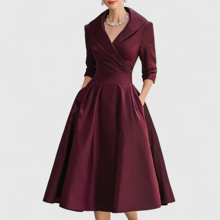 Stylish women's midi dress with 3/4 sleeves, elegant V-neck, and convenient pockets. Great for a casual chic look.
