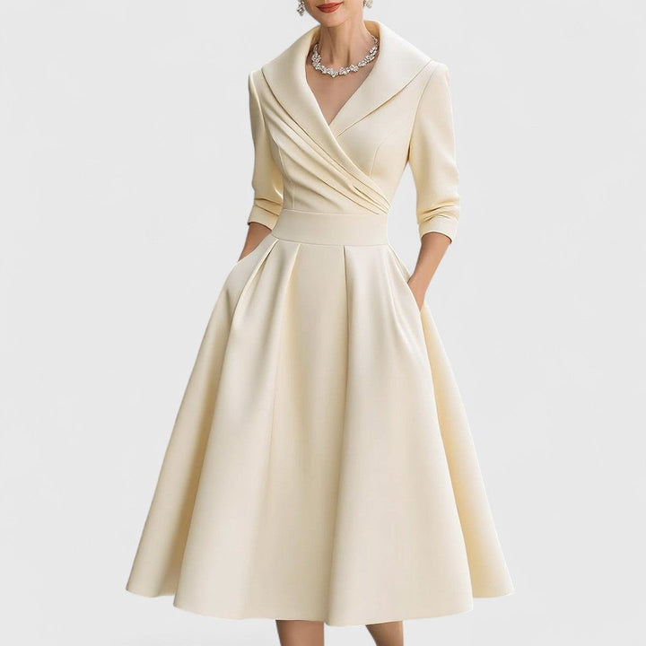 Flattering V-neck midi dress for women, with 3/4 sleeves, pockets, and an elegant flared silhouette. Perfect fashion.