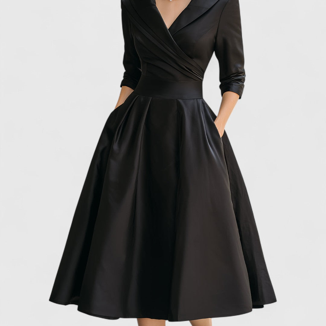 Comfortable yet elegant V-neck midi dress for women with 3/4 sleeves, pockets, and a chic flared skirt design.