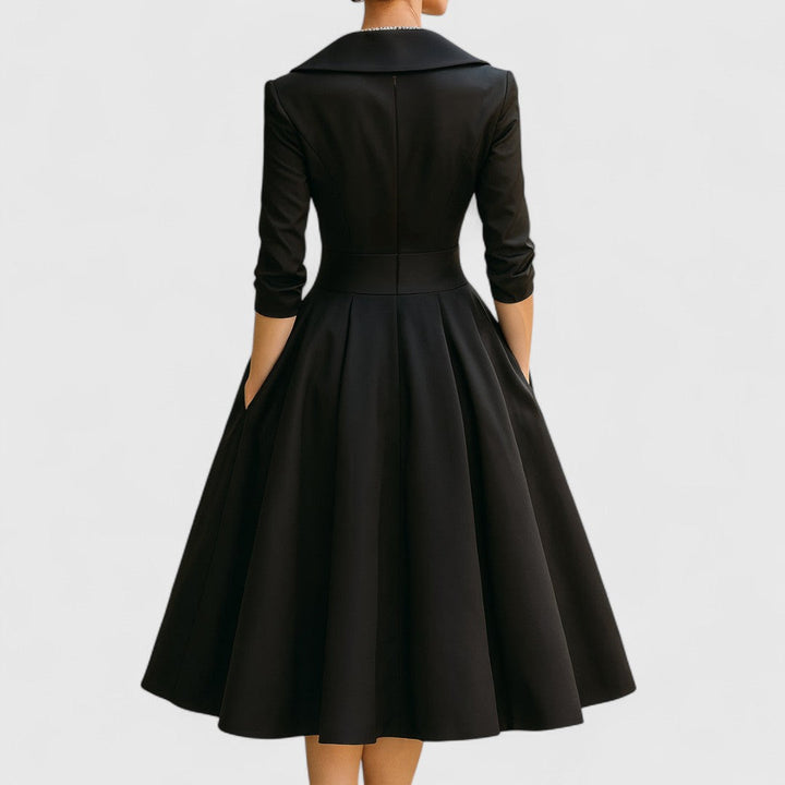 Modern women's fashion: V-neck midi dress with 3/4 sleeves, pockets, and a flared skirt for an elegant look.