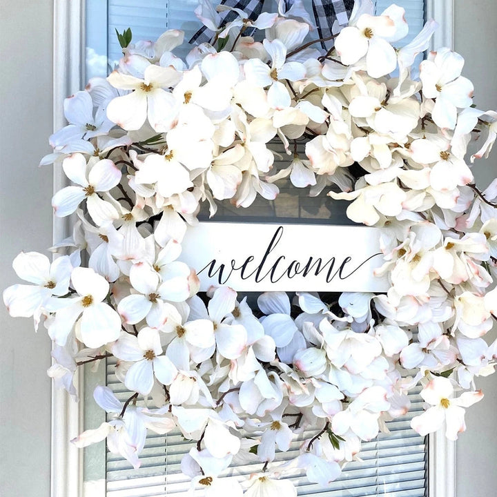 Detailed white dogwood floral wreath, ideal wall or door decor for an elegant touch.