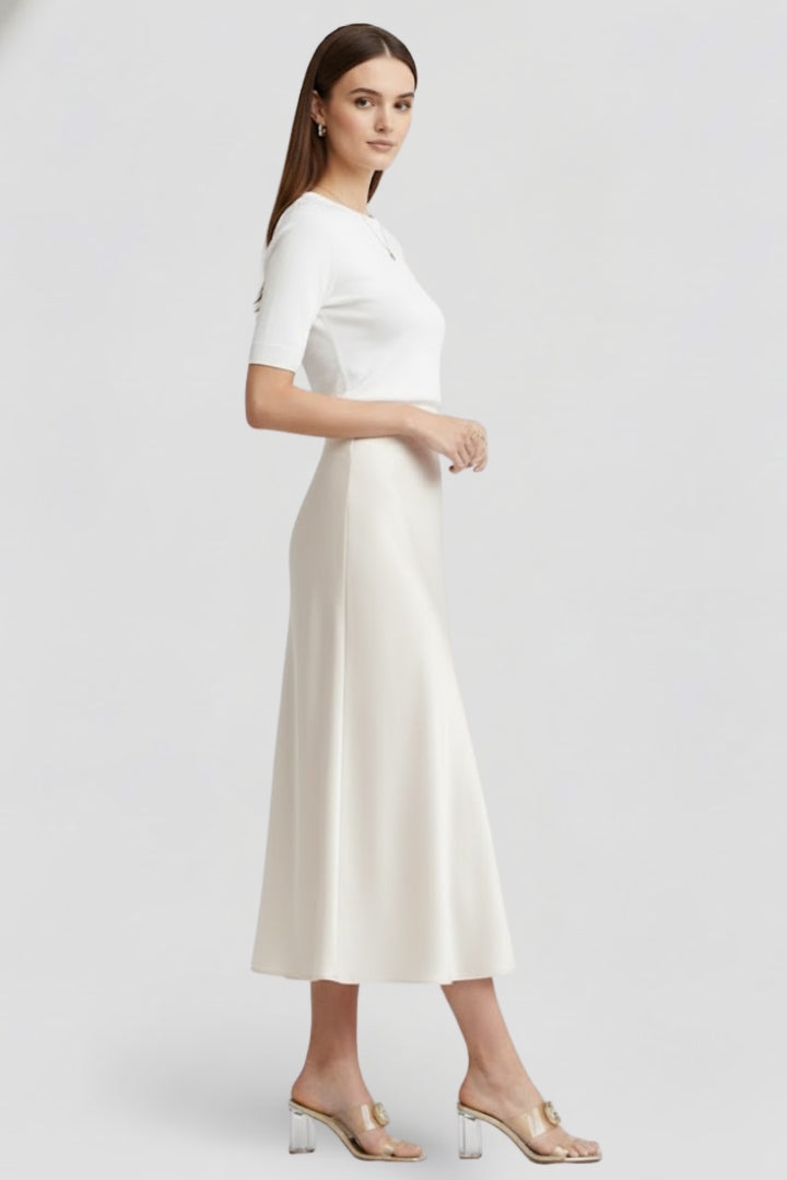 Women's white high-waist draped midi skirt, a flattering and chic piece for any ensemble.