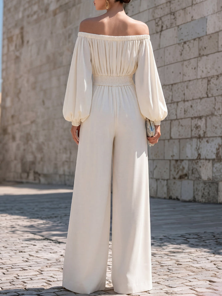 Women's flowing white maxi dress featuring an off-shoulder neckline and stylish bishop sleeves.