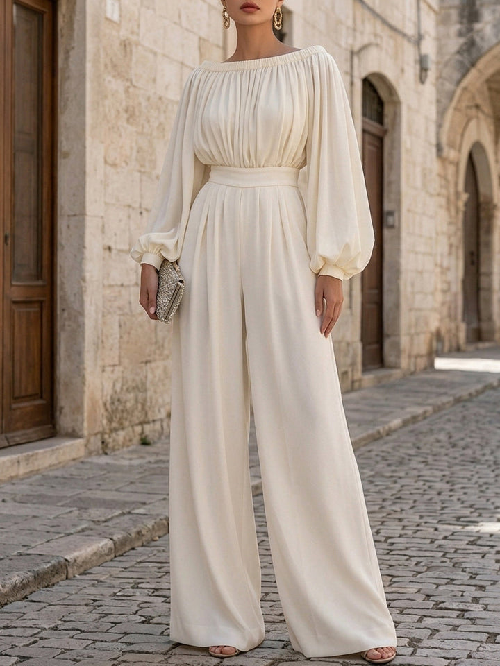 Stunning white off-shoulder formal dress with elegant bishop sleeves, ideal as an evening gown.
