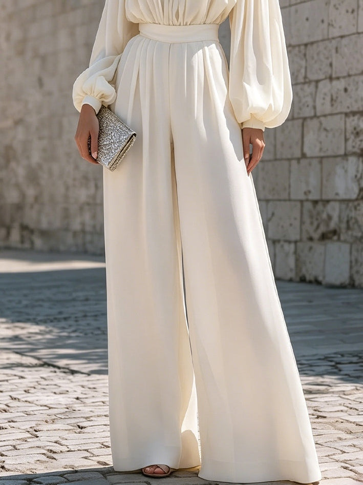 Classic white elegant maxi dress with an off-shoulder cut and sophisticated bishop sleeves.