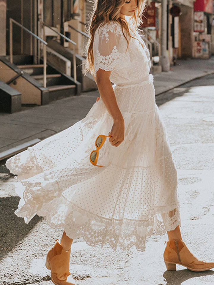 Women's elegant V-neck lace A-line midi dress. Bohemian summer fashion with short sleeves for any occasion.