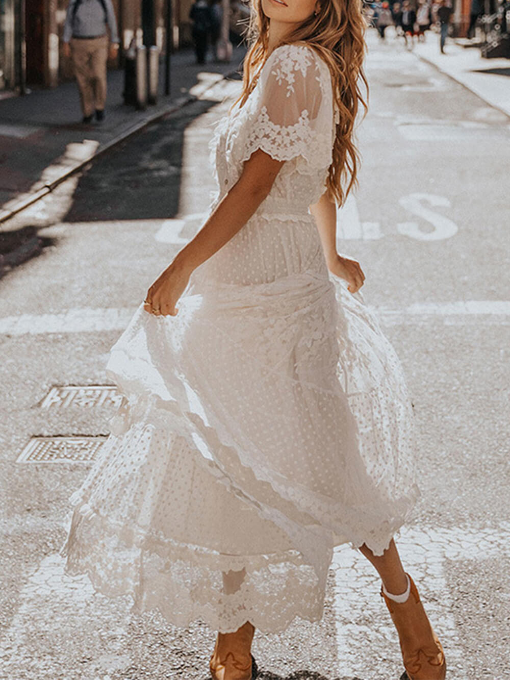 Chic women's white midi dress featuring a V-neck, delicate lace, and flattering A-line silhouette. Summer wear.