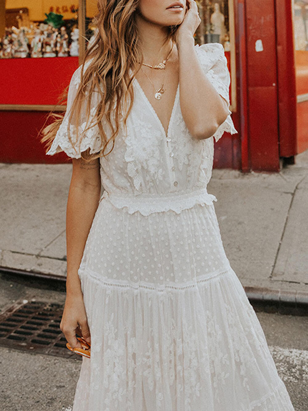 Bohemian V-neck lace A-line midi dress for women with short sleeves. Elegant white summer fashion.