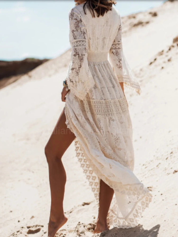 Elegant white V-neck tiered maxi dress for women. Long sleeve, flowy evening or party dress. Womens fashion.
