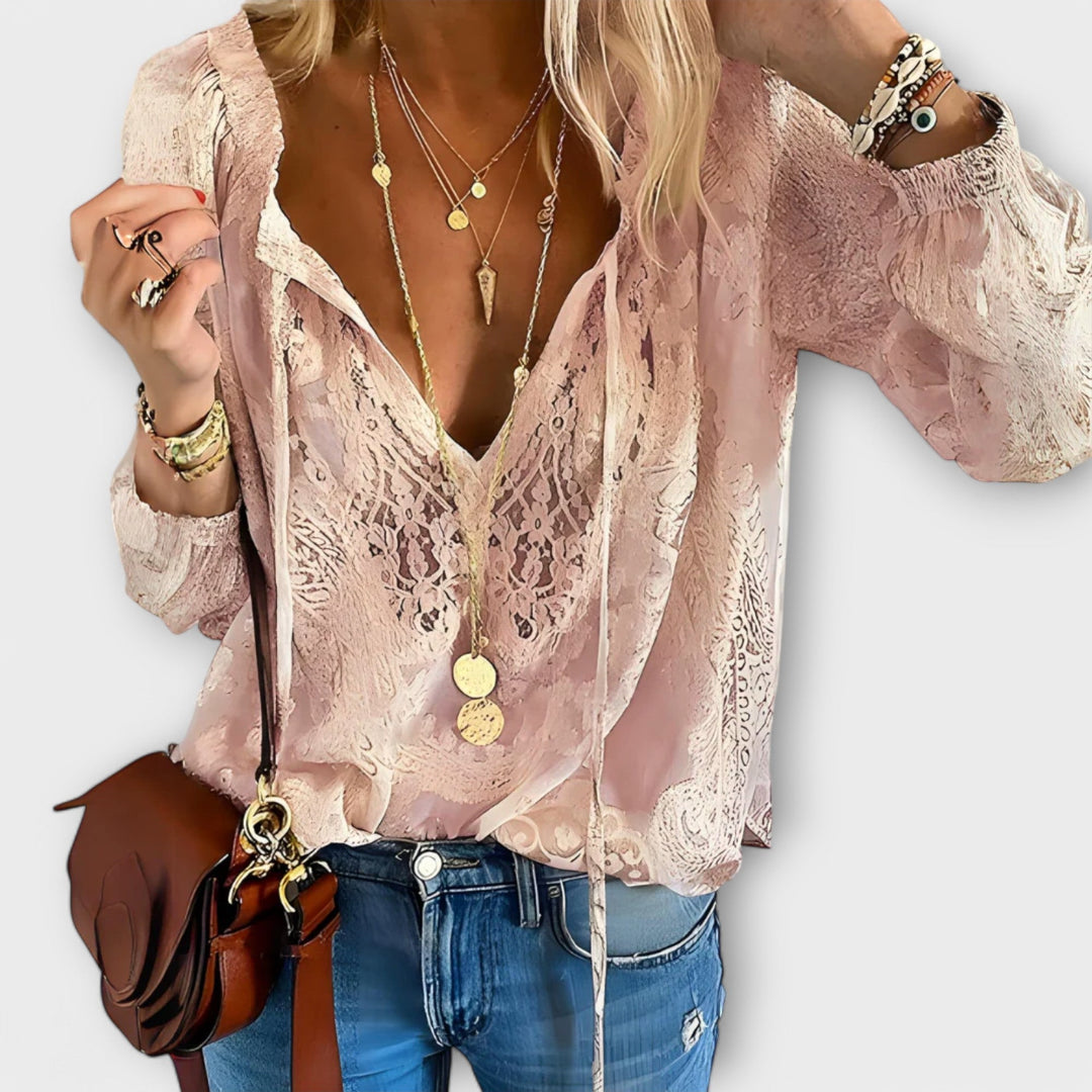 Chic women's tie-neck blouse with delicate details, an elegant and versatile top for casual or sophisticated looks.