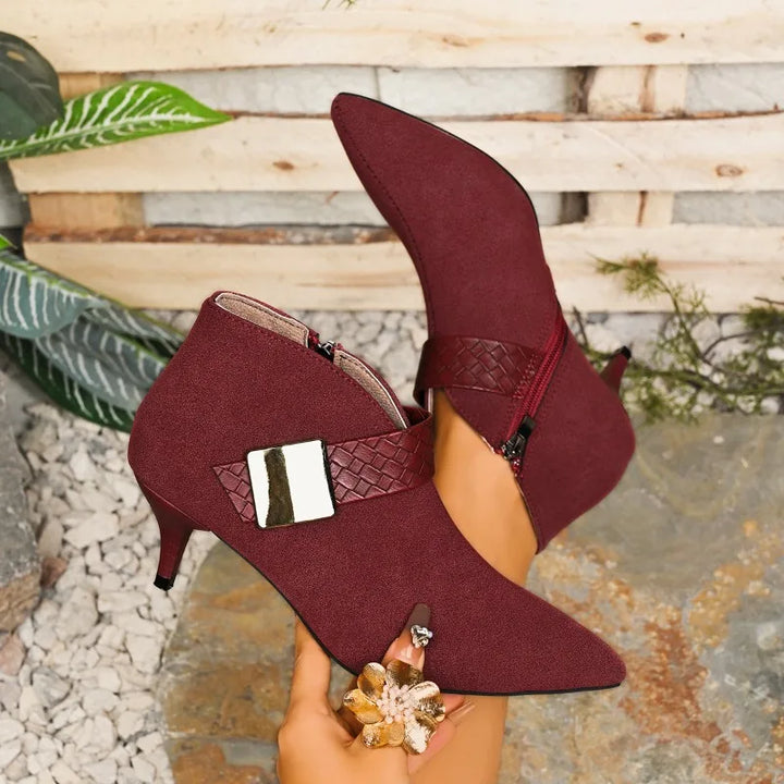 A collection of women's pointed toe stiletto heels in wine red, black, and brown, showcasing color options.