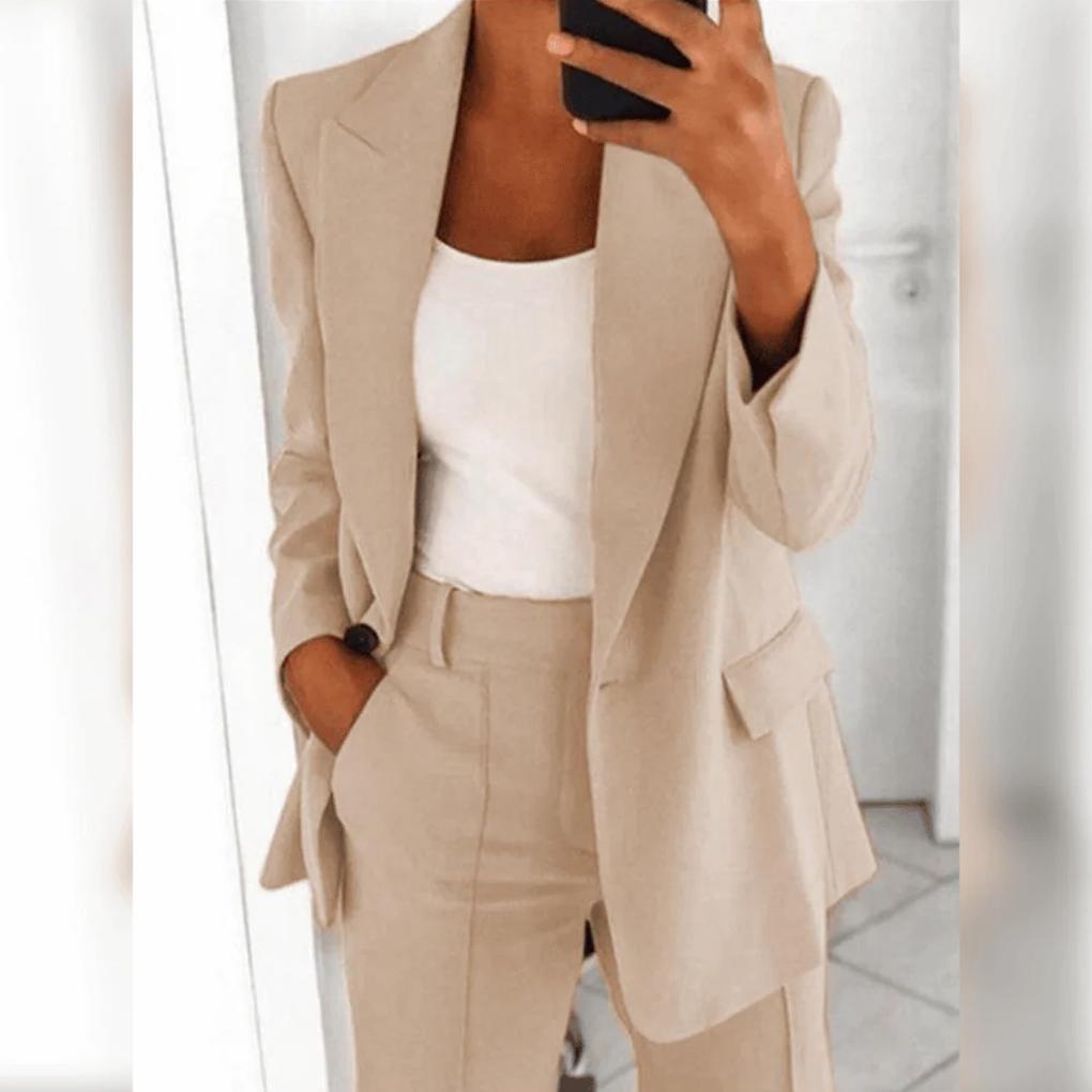 Modern women's power suit: sleek blazer and tailored trousers creating a sophisticated professional outfit.